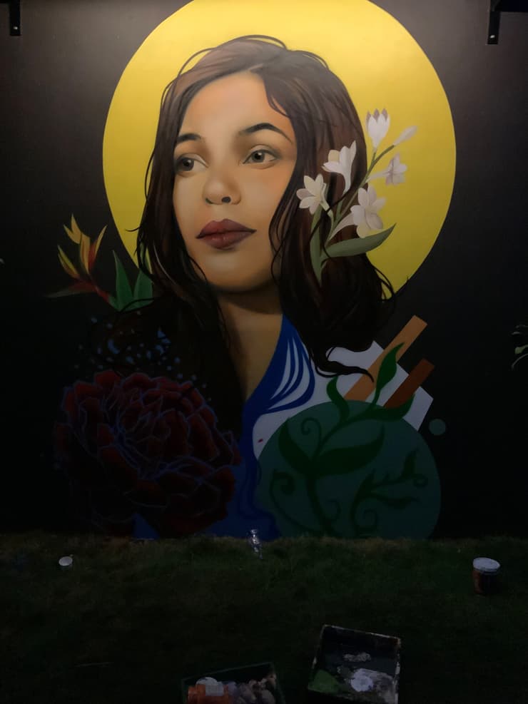Woman with yellow halo, black wall, detail 2