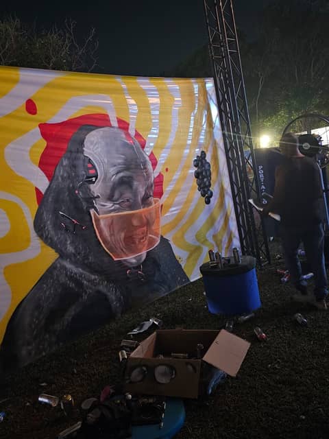 Festival banner, masked figure on swirls