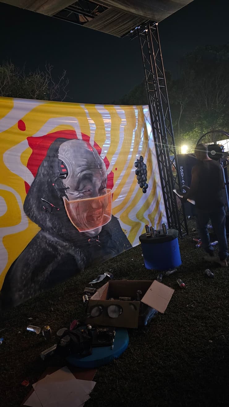 Festival banner, masked figure on swirls