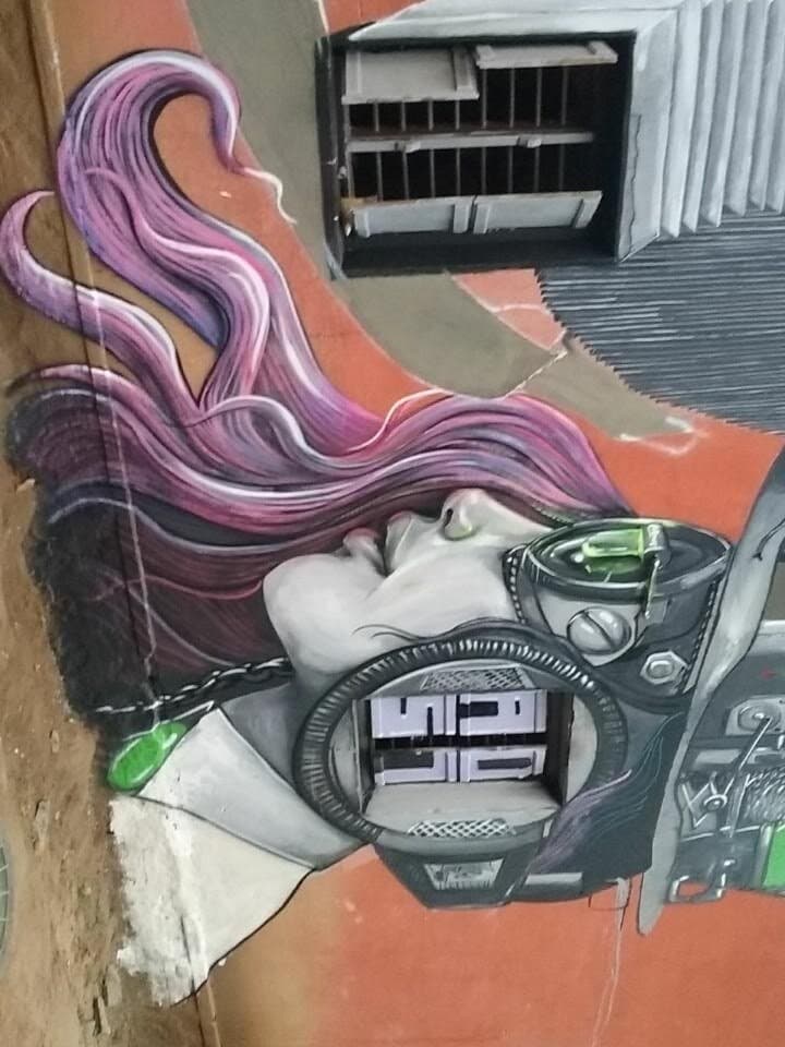 Mech woman with pink hair, orange wall, Kodagu