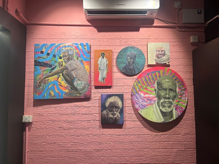 Canvas portraits on pink wall, Chennai