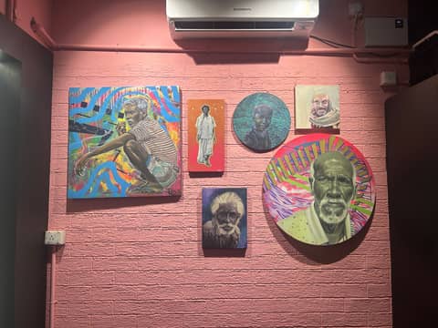 Canvas portraits on pink wall, Chennai
